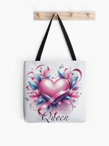 A white tote bag with a pink heart and the word “Queen”